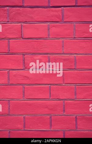 pink brick wall texture background close up vertical Stock Photo