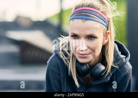 Runner taking short break during workout Stock Photo