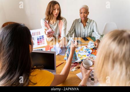 Fashion designers having a meeting in office Stock Photo