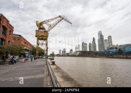Warehouse and crane by the river in Puerto Madero, Buenos Aires, Argentina Stock Photo