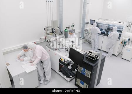 Team of scientists working in laboratory of technology center Stock Photo