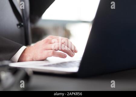 man's hand and laptop Stock Photo