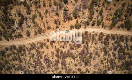 Aerial view of jeep on dirt track, Opuwo, Namibia Stock Photo