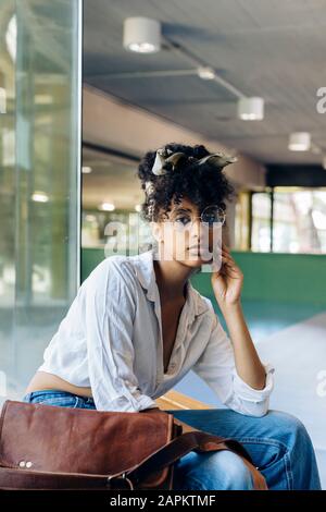 Portrait of young woman with curly black hair Stock Photo