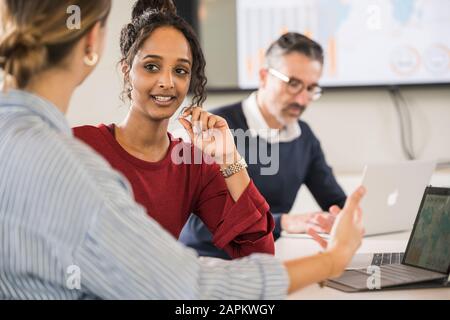 Two young businesswomen in a meeting in office Stock Photo