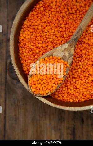 Overhead view of bowl of organic red lentils Stock Photo