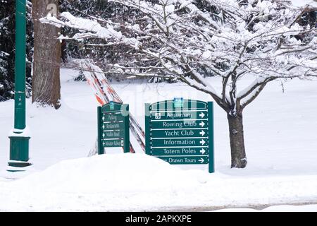 Vancouver, Canada - January 15, 2020: View of direction sign board covered in snow in Stanley Park. Snowfall and extreme weather in Vancouver. Stock Photo