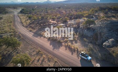 Aerial view of jeep on dirt track, Opuwo, Namibia Stock Photo
