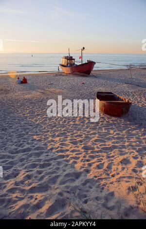 fisherman boats at sunrise time on the beach in summer Stock Photo