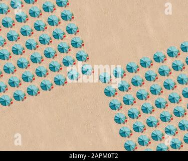 Aerial view of arrangement of turquoise colored beach umbrellas Stock Photo