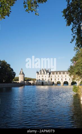 France, Centre-Val de Loire, Chenonceaux, Clear sky over Chateau de Chenonceau and Cher river Stock Photo
