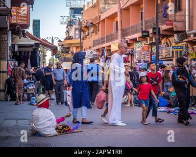 MARRAKECH, MOROCCO - Jun 03, 2018: Anonymous poor beggar in the street of Marrakech, Morocco Stock Photo