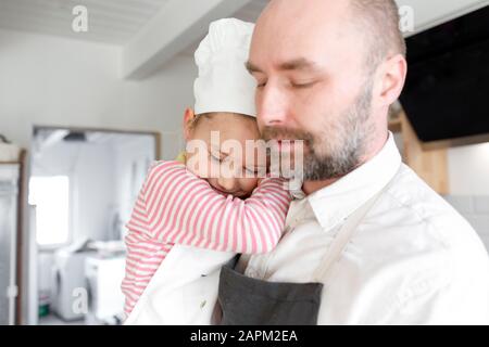 Father and daughter cooking in the kitchen Stock Photo
