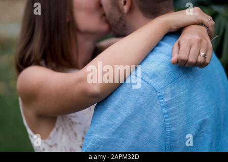 Couple in love kissing outdoors Stock Photo