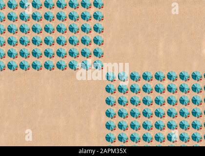 Aerial view of arrangement of turquoise colored beach umbrellas Stock Photo