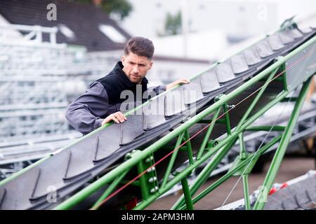 Skilled worker, working in conveyor belt shop Stock Photo