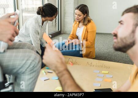 Young business people working together on a project in office Stock Photo