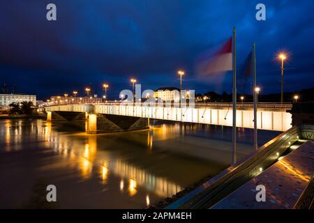 Austria, Upper Austria, Linz, Nibelungenbrucke bridge crossing Danube river at night Stock Photo