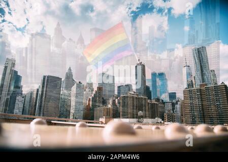 USA, New York, New York City,Manhattan skyline with rainbow flag Stock Photo