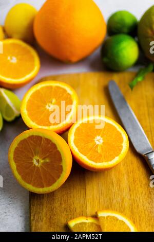 Freshly cut oranges on cutting board Stock Photo