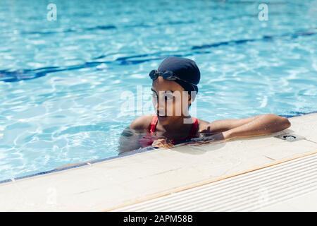 Portrait of young woman in swimming  pool Stock Photo