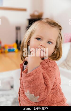 Portrait of little girl at home Stock Photo
