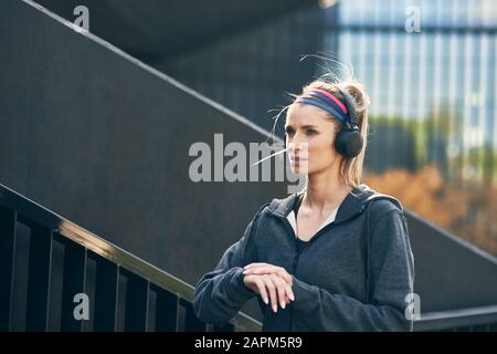 Runner taking short break during workout Stock Photo