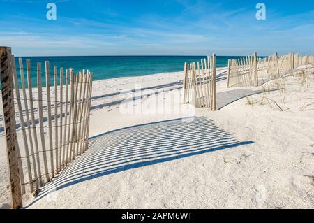 Empty white sand beach with fences,  Gulf of Mexico coast, Alabama, USA Stock Photo