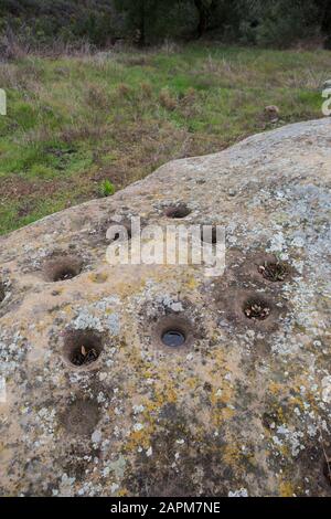 Acorn grinding mortar stones at the Wildlands Conservancy Mariposa Reserve, Tongva American native Indian village Cleveland National Forest California Stock Photo