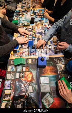 10 January 2020, Hessen, Frankfurt/Main: Numerous players take part in a tournament of the trading card game 'Magic'. Photo: Frank Rumpenhorst/dpa Stock Photo