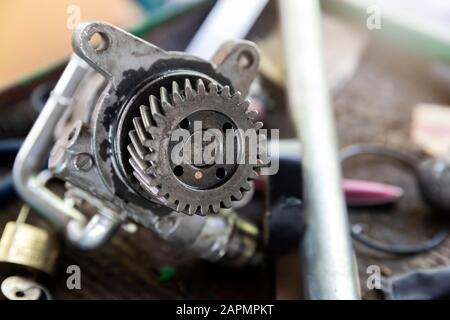Car gear part on tray in the car repair garage. Stock Photo