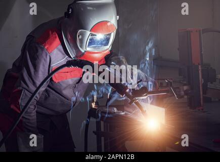 Welding robots movement in a car factory Stock Photo