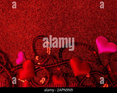 Poster with red and pink hearts, sparkles, glitter, Happy Valentines Day on festive background. Wallpaper for Valentines Day. Love concept Stock Photo