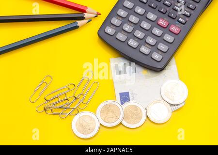 Papers, glasses and calculator to make calculations of the invoices we receive, to make graphs and statistics of our expenses or benefits. scientific Stock Photo