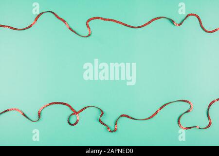 Delicate mint background with red ribbons. Place for text Stock Photo
