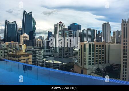 Swimming pool view of the modern skyline of Panama City , Panama. View from the top of building Stock Photo