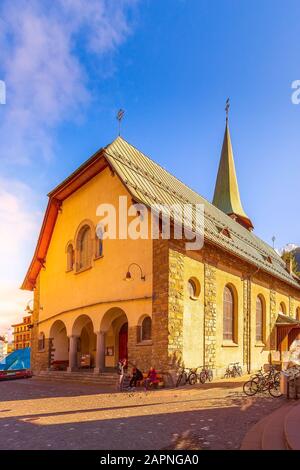 Zermatt, Switzerland - October 7, 2019: Town street view with St. Mauritius Church in famous swiss ski resort Stock Photo