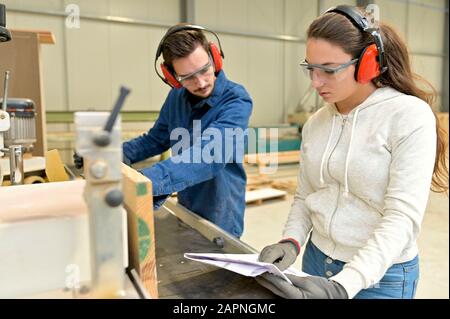 Students in carpentry doing a job training in workshop Stock Photo
