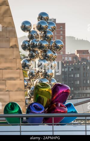 Silver Balls by Anish Kapoor and Tulips by Jeff Koons outside the Guggenheim Art Museum in Bilbao, Spain. Stock Photo