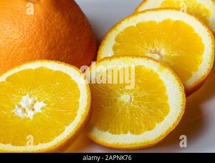 Orange slices on white background. Stock Photo