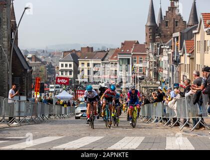 Geraardsbergen, Belgium - April 7, 2019 : The feminine breakaway riding on a cobblestone road in Geraardsbergen during Women Tour of Flanders 2019. Stock Photo