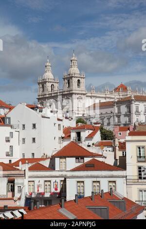 View of the Alfama Neighbourhood in Lisbon, Portugal, with colourful buildings and the National Pantheon Stock Photo