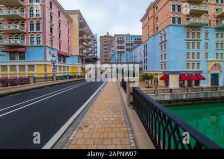 DOHA, QATAR - January 10 2020. Canal view in Venice-like Qanat Quartier of the Pearl precinct of Doha, Qatar, with multi-color residential buildings, Stock Photo