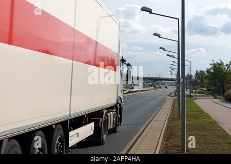 Poland. Warsaw. Truck in city traffic. A multi-lane road. Stock Photo