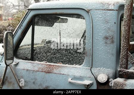 Fresh snow on old truck Stock Photo