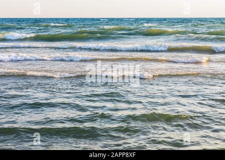 Texture of the sea with small waves near the shore during a storm Stock Photo