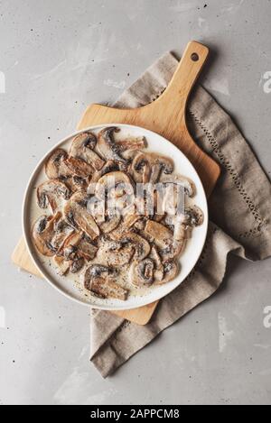 Stewed mushrooms in sour cream with portulak.Fresh mushroom stew with vegetables. Stock Photo