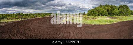 A railway track used for machine access to an industrial Bord na Mona cut away bog used for peat extraction near Cloghan, County Offaly, Ireland Stock Photo