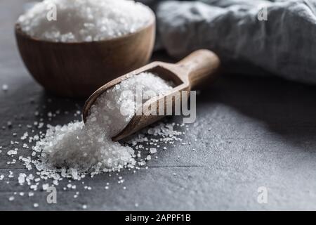 Crystaline sea salt in bowl and spoon - closeup Stock Photo