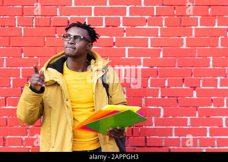 African American man trying complex decides chooses offers options Stock Photo